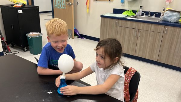 Kids love a good acid-base reaction. Here the CO2 created by mixing vinegar and baking soda inflates the balloon.