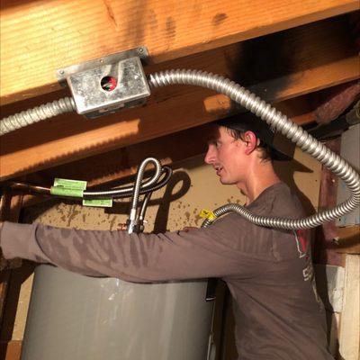 Wes putting the finishing touches on this brand new water heater.