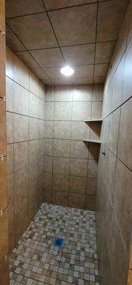 Shampoo shelf tile installation