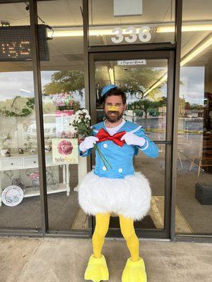 Donald Duck's long-lost brother? Mitch delivers a bouquet with a side of feathers. Bet lost or fashion statement? You decide!