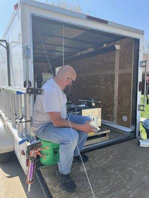 Cody, measuring and cutting seamless gutters right at your footstep!