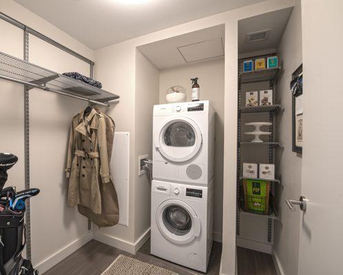 Ample storage with a separate area for in unit washer and dryer.