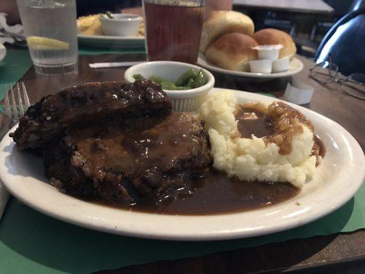 Meatloaf, mashed potatoes, lots of gravy, green beans and of course rolls!