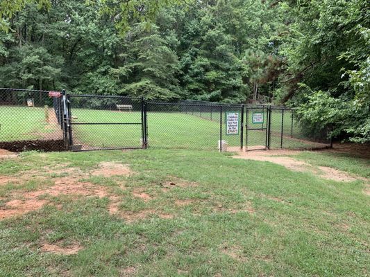 This is the small dog area with two rotting benches.