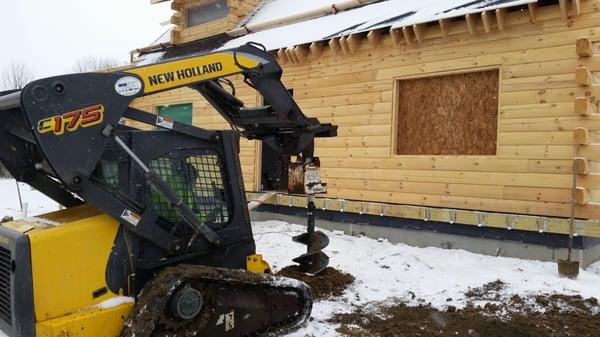 Drilling down 42", getting ready to pour concrete footers for the posts of a new deck