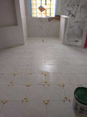 All tile was installed by us including shower, walls and floors