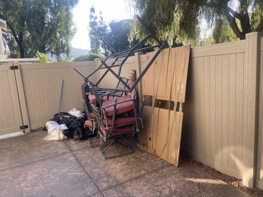 Patio furniture just left piled up with their trash left behind