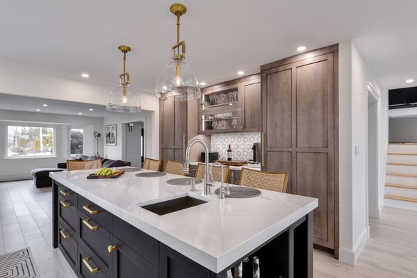 Custom Rutt kitchen, brass hardware, open to dining and living areas. Long kitchen island. South Shore Long Island , NY