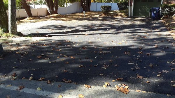 Finished 3 car driveway with berm at street entrance