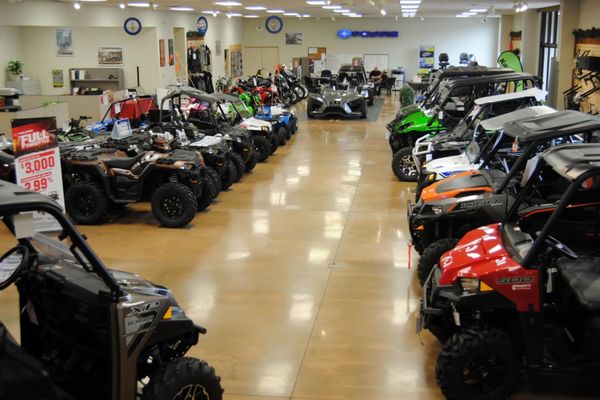 A showroom full of Kawasaki and Polaris product.