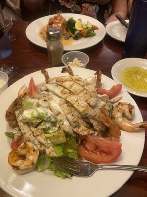 Caesar salad with grilled chicken and grilled shrimp