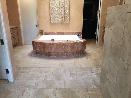 The Master Bath Tub also in the original dark rust marble