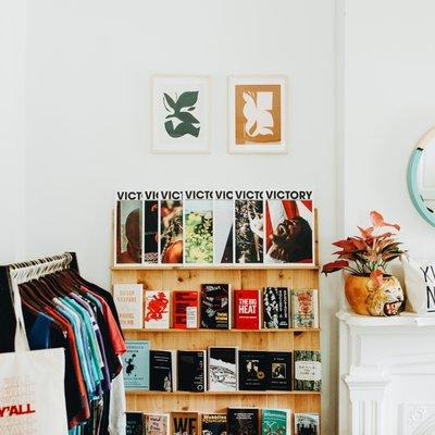 DNO Garden District Annex Gallery with bookshelf near fireplace/mantel