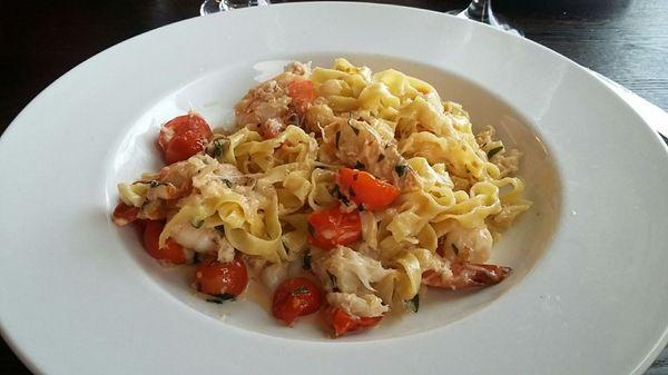 Handmade fettucini seafood pasta, tiny sweet tomatoes and large shrimp and crab hidden in there, YUM!!