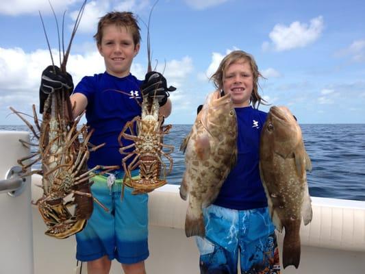 Tucker & JC showing off there catch aboard Two Conchs Charters out of Big Time Bait and Tackle.