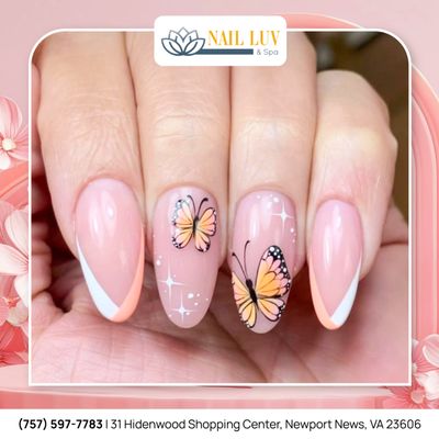 Elegant with pastel pink nails and delicate butterfly designs. A perfect choice for a soft, feminine look