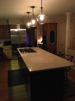 Beautiful pendant lights installed in the kitchen. They are sleek & modern and just a wowzer!