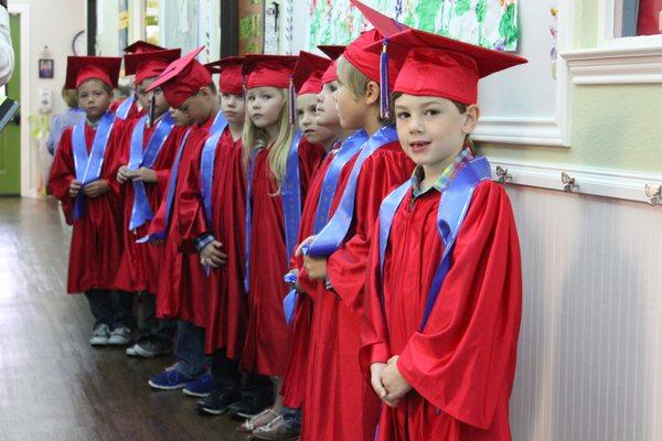 Our kindergarten students wait patiently to enter their graduation ceremony at the end of the year!  They are ready to move on to 1st grade!