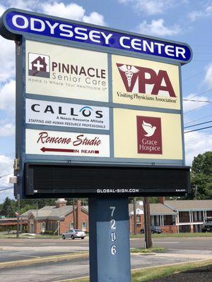 Sign out in front of the Odyssey Center building .