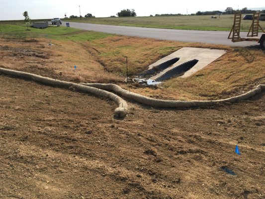 Straw waddles to prevent silting in of culver pipes as we prep for sod.