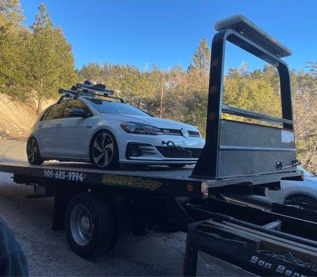 Car being towed from big bear.