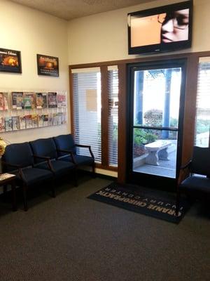 Part of the waiting area with TV