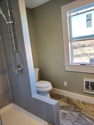 Custom tile on shower and floor 
Splash of new paint