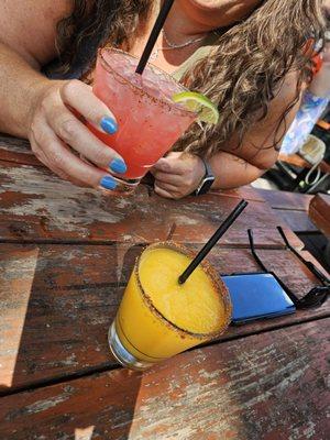 Cheers!!! Spicy Hibiscus Marg (pink & delish) with the Mango Frozen Lemonade marg (peachy and refreshing)