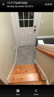 New stairs, half wall, railing, and tile landing