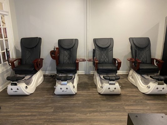 Pedicure chairs with back-massaging features.