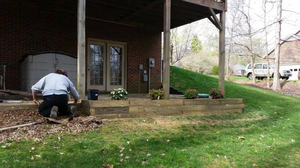 Previous drainage and grade problems solved by installing timber planter boxes and custom stairs.