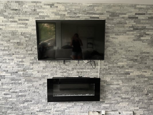 Rock tile wall and fireplace