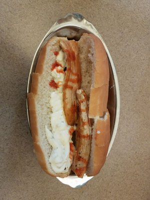 Grilled mahi mahi sandwich - two tiny pieces of fish, a giant glob if tartar sauce on a stale hotdog bun.