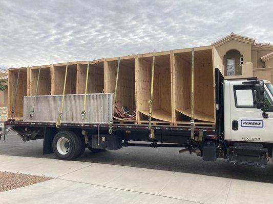 Moving trucks with crates.