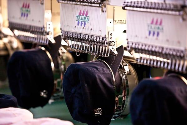 embroidery machines working the hats