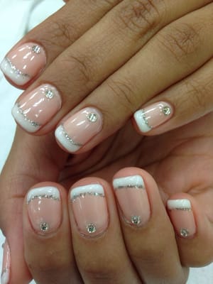 gel manicure with white glitter tip and rhinestones!