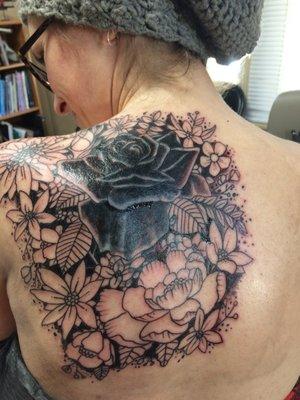 After-the shading is the worst part! I love how he left bits of the old tattoo to let it's color lend depth to the black rose centerpiece.