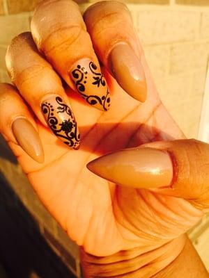 Lace design on nude stiletto nails