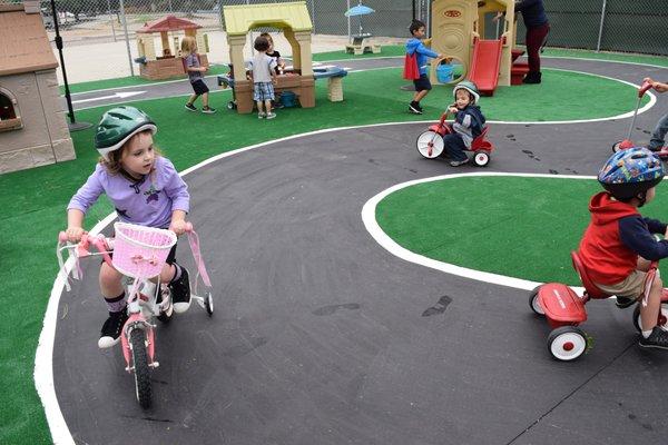 Preschoolers head out to the Y's bike park and tiny town.