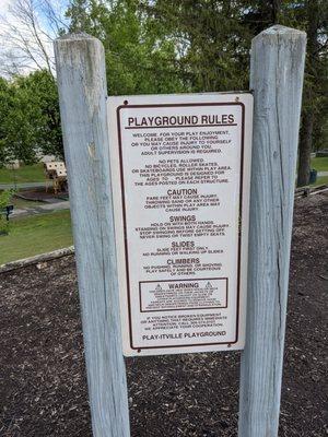 Play ground rules for upper play area. (It's right next to the shelter with picnic tables.)