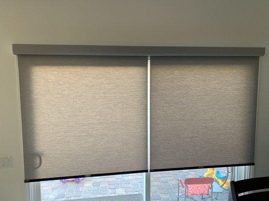 Patio door roll up blinds.