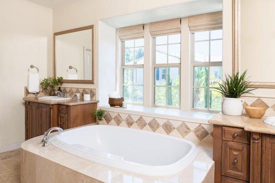 Motorized woven wood shades were the perfect finishing touch to this beautiful contemporary bathroom!...