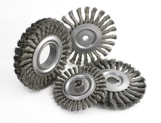 Manufacturing crimped and knotted wire wheels for aggressive cleaning and deburring.