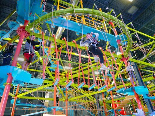 Adults enjoying the Sky Trail high ropes course