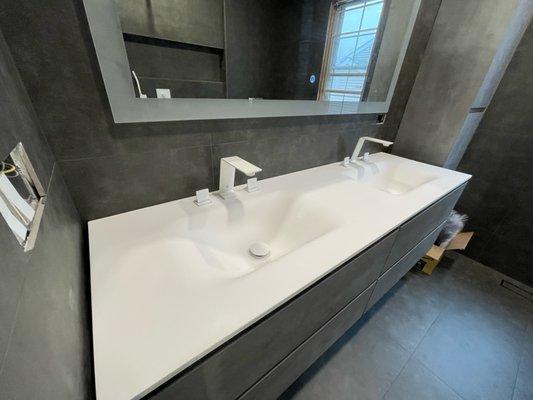 Double lavatory sink and faucet installation