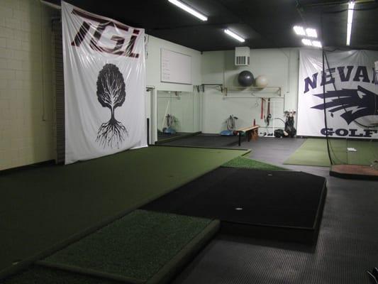 Putting green with fitness area in background.