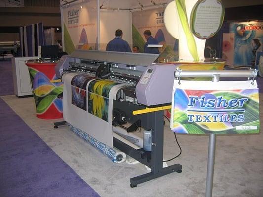 Printing demonstrations on Fisher fabrics at Fisher Textiles' Trade Show booth at the International Sign Expo.