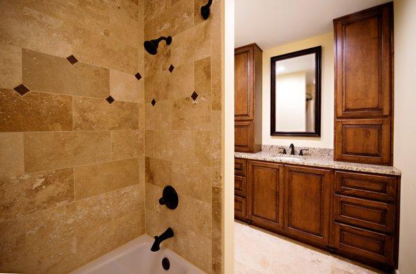 Hallway Bathroom: Travertine tile was used throughout, providing a clean look. 18x18 for the floor with 9x18 subway tiles for the shower.