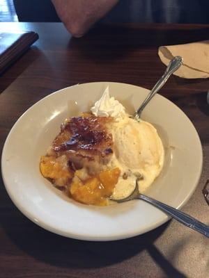 Warm sweet peaches with a generous dollop of ice cream. Yummer!