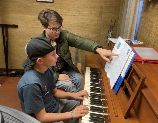 Our Instructor Jacob helping piano student Weston Anderson